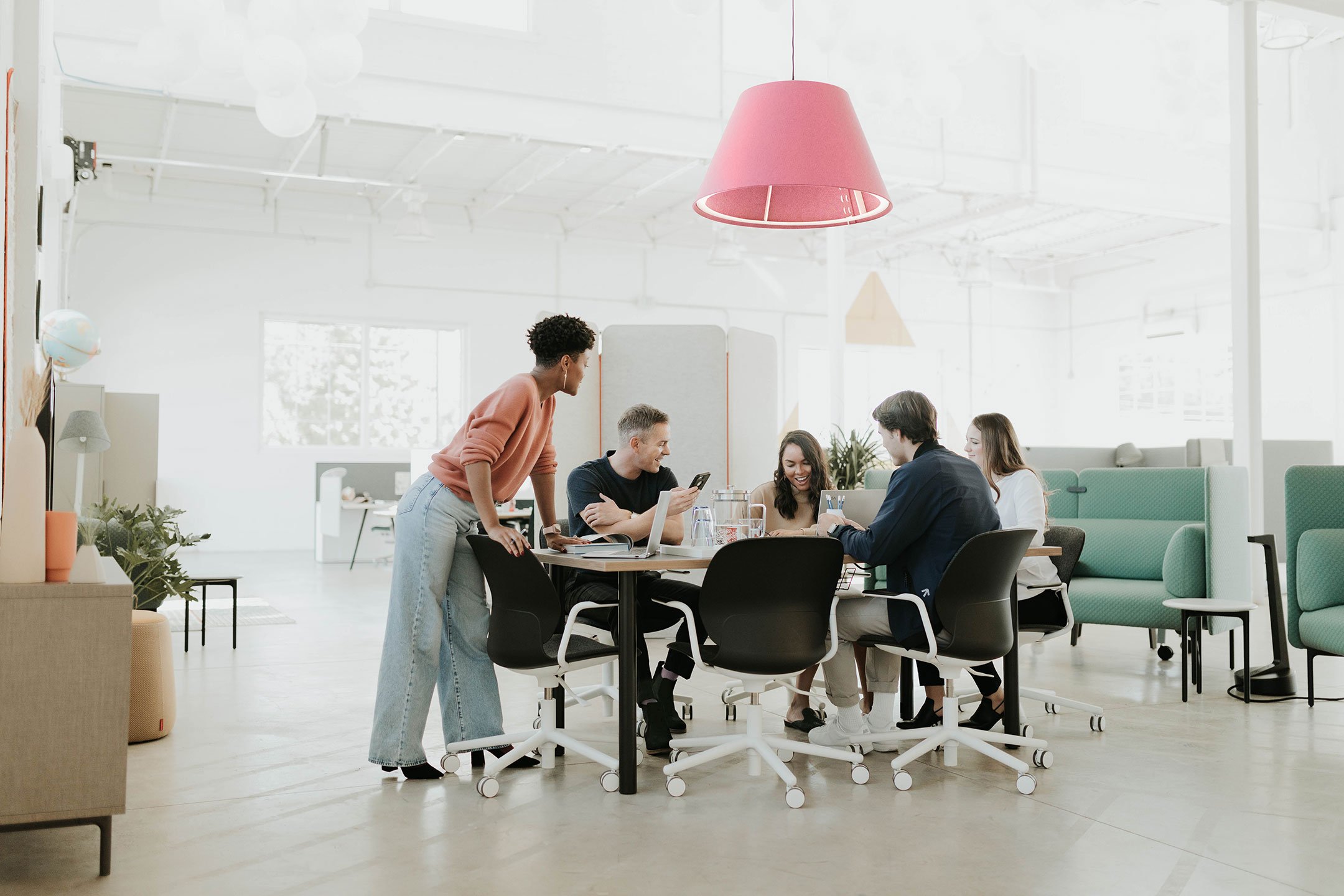 Haworth Jive Table in an open office casual setting collaborating on a progress