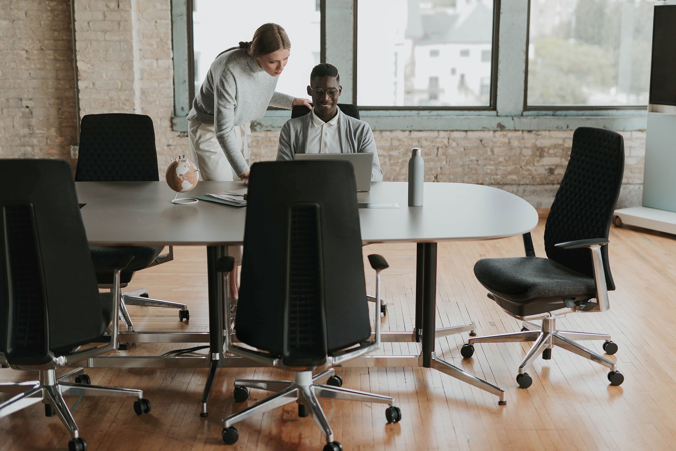 Haworth Jive Table in a office meeting room with collaborators working on a project together