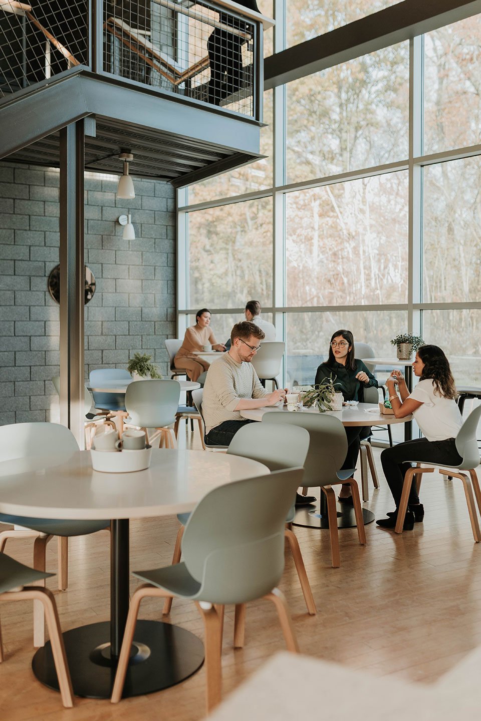 Haworth Jive Table with white circular top in a casual office social area