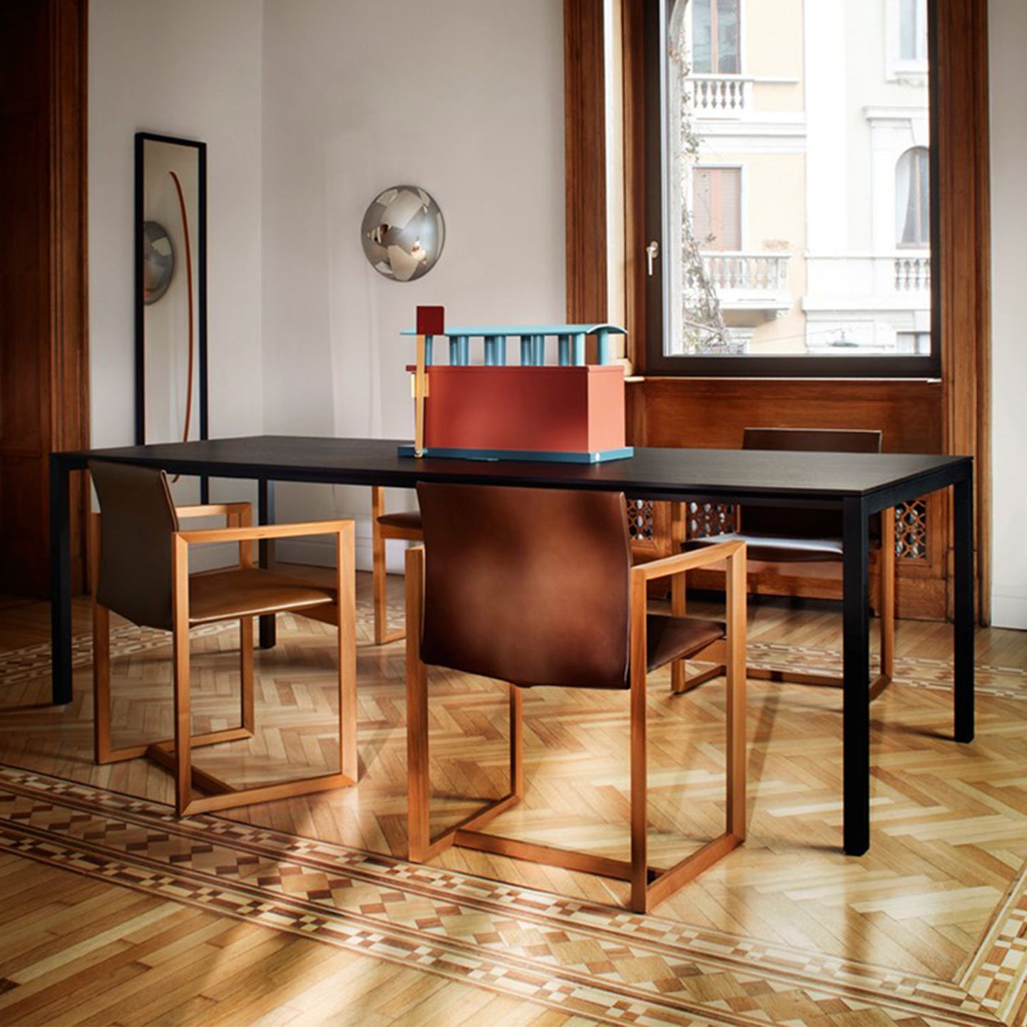 Haworth Naan Table with black top in home dining room looking out into city