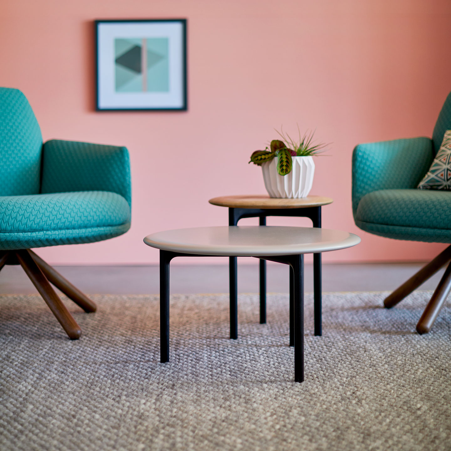 Haworth Openest Sprig Side Table in a conversation area as a side book table with a plant on it 