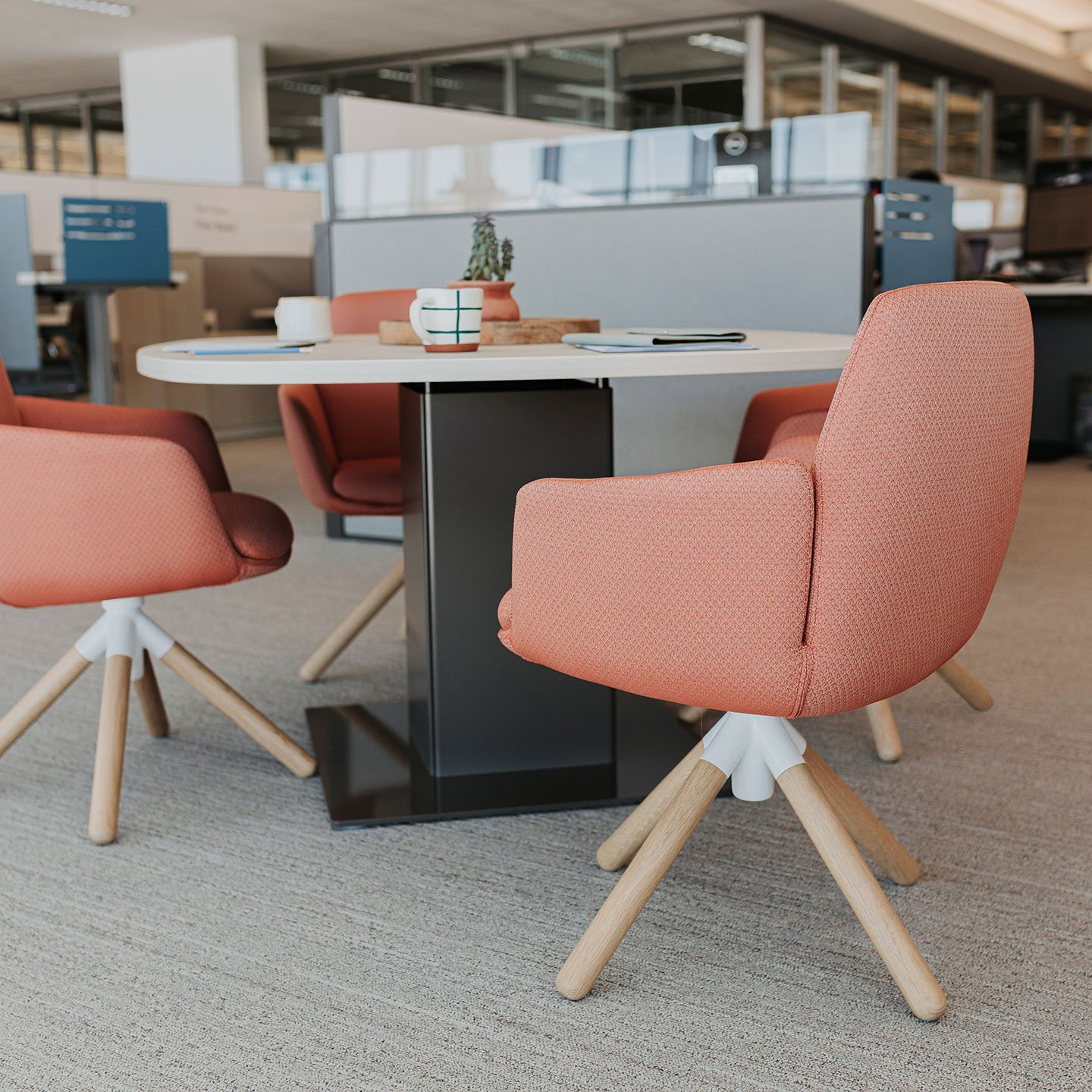 Haworth Planes Conference Table in a open office space with chairs for collaboration 