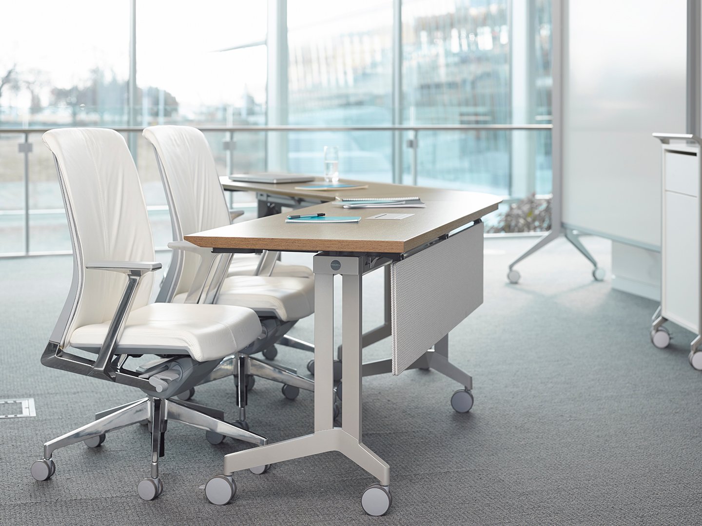 Haworth Planes Training Table in an open setting in an office with a white board