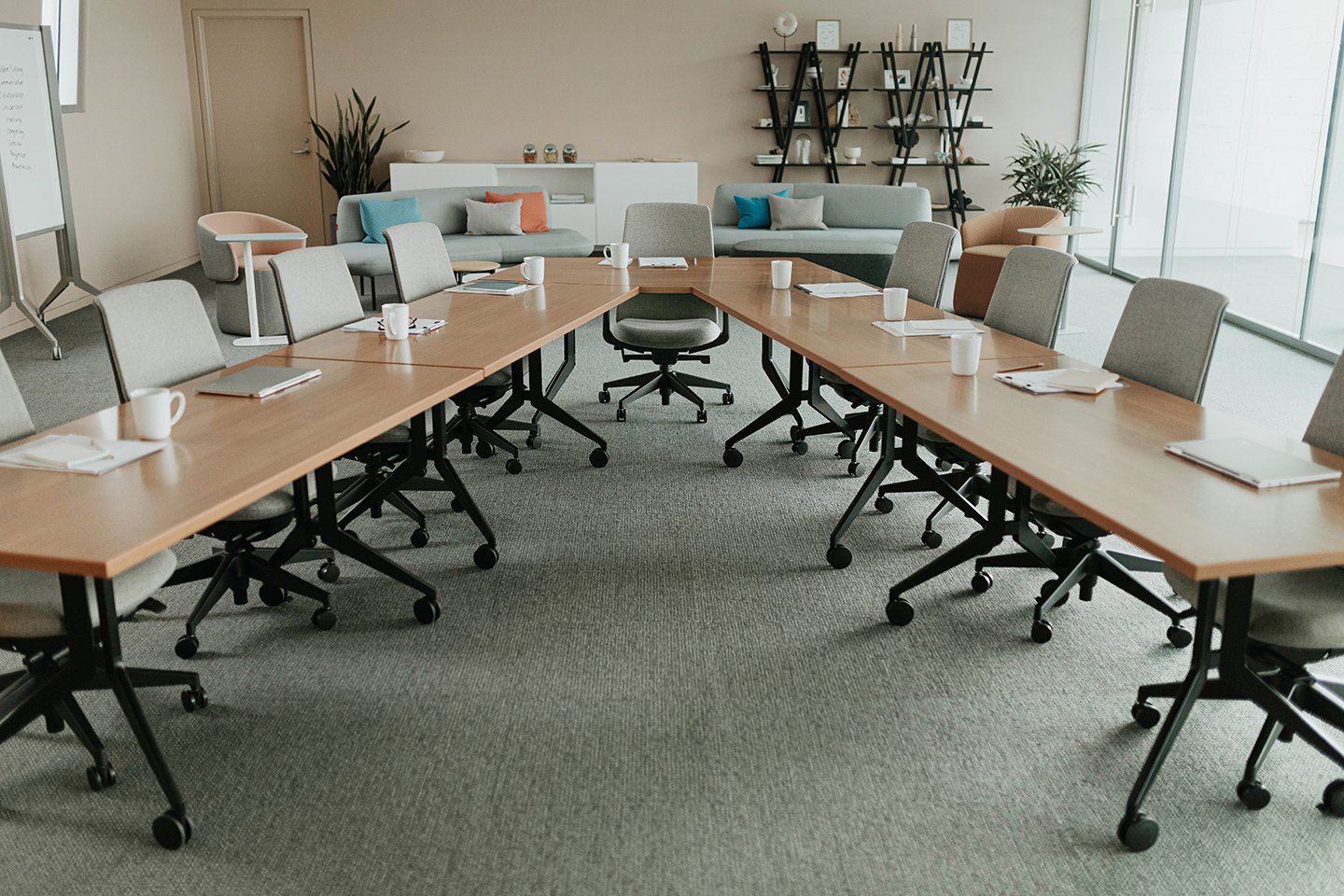 Haworth Planes Training Table in a closed conference room with haworth furniture and set up for a meeting