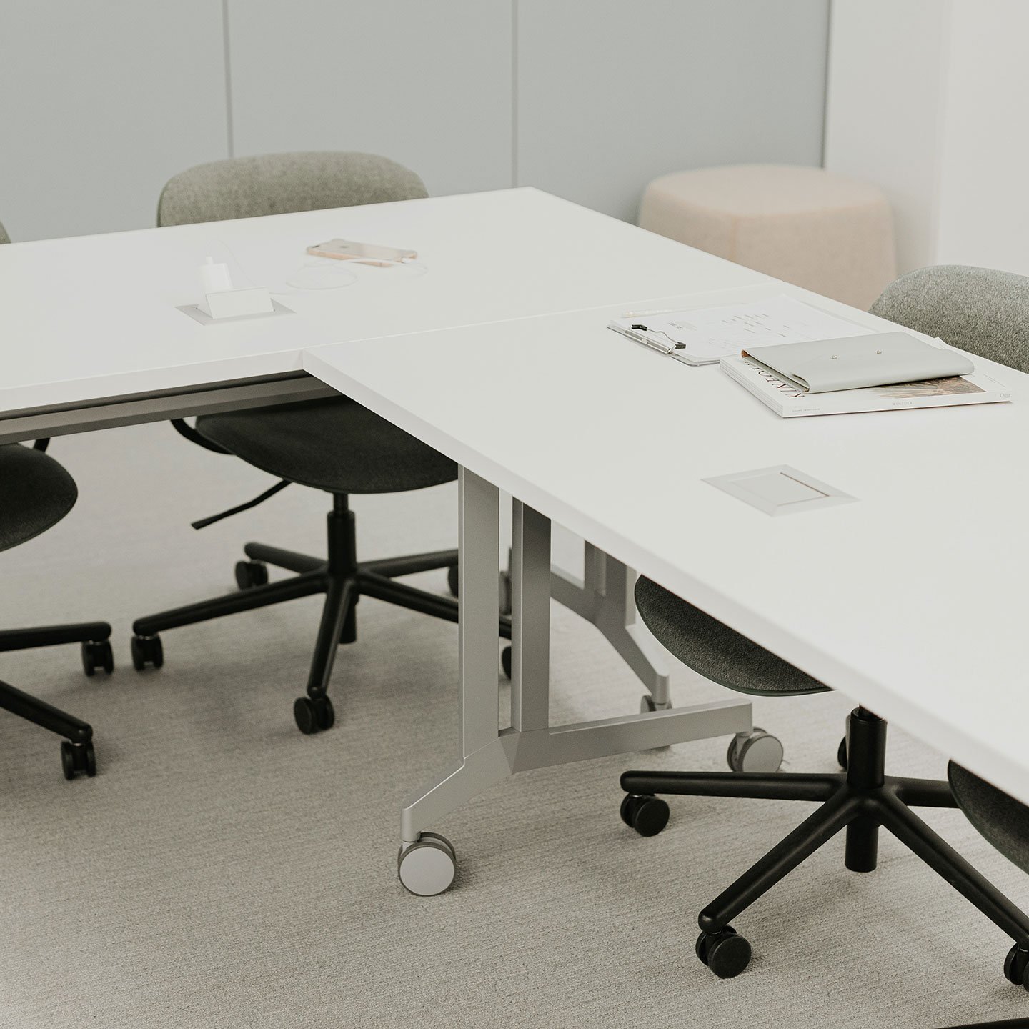 Haworth Planes Training Table in a office space with books on it and haworth furniture