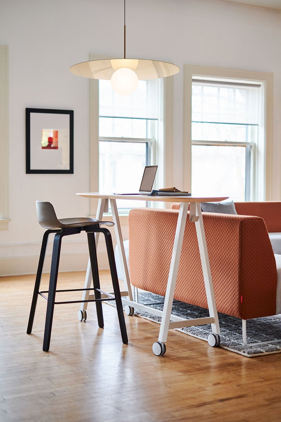 Haworth PopUp Table in a office lounge being used as a work space