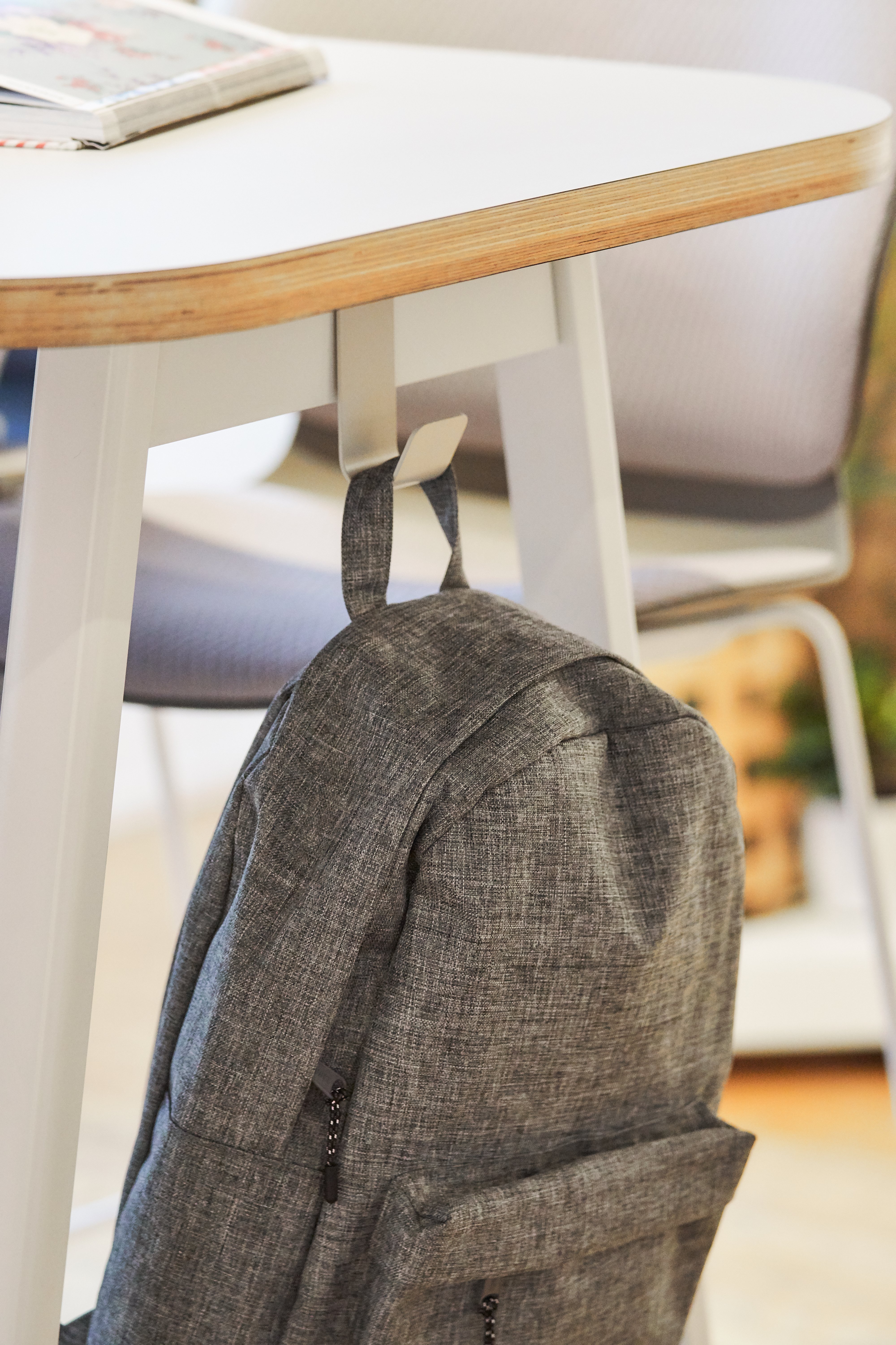 Haworth PopUp Table in a classroom with a backpack hooked to the side