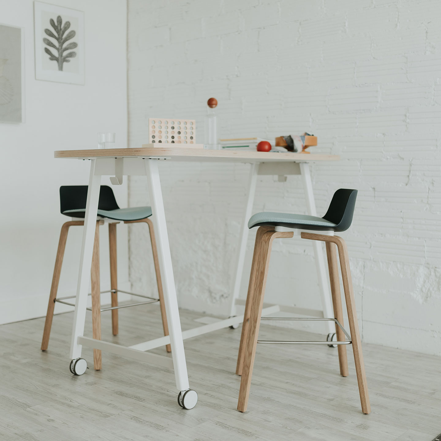 Haworth PopUp Table in a casual open space with water and books on the table with haworth furniture