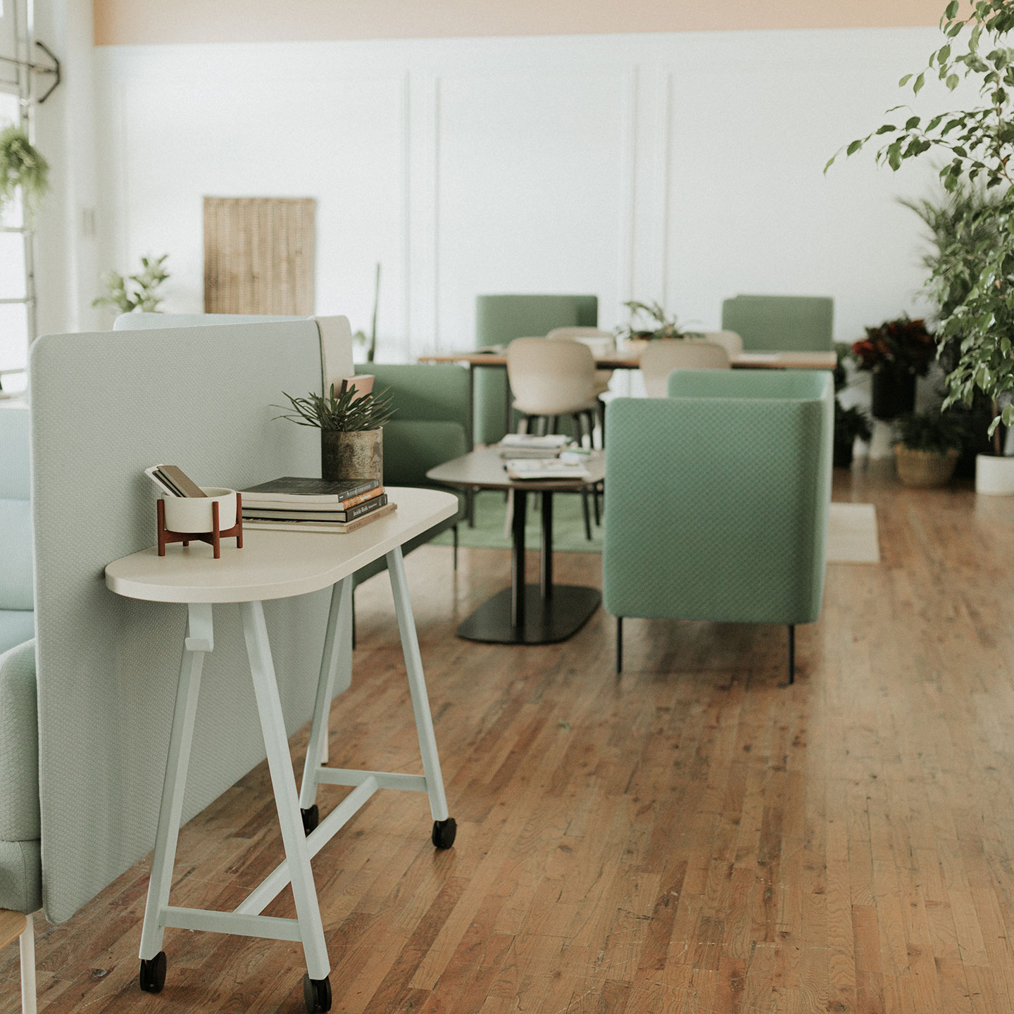 Haworth PopUp Table in a office lounge being used as a side table