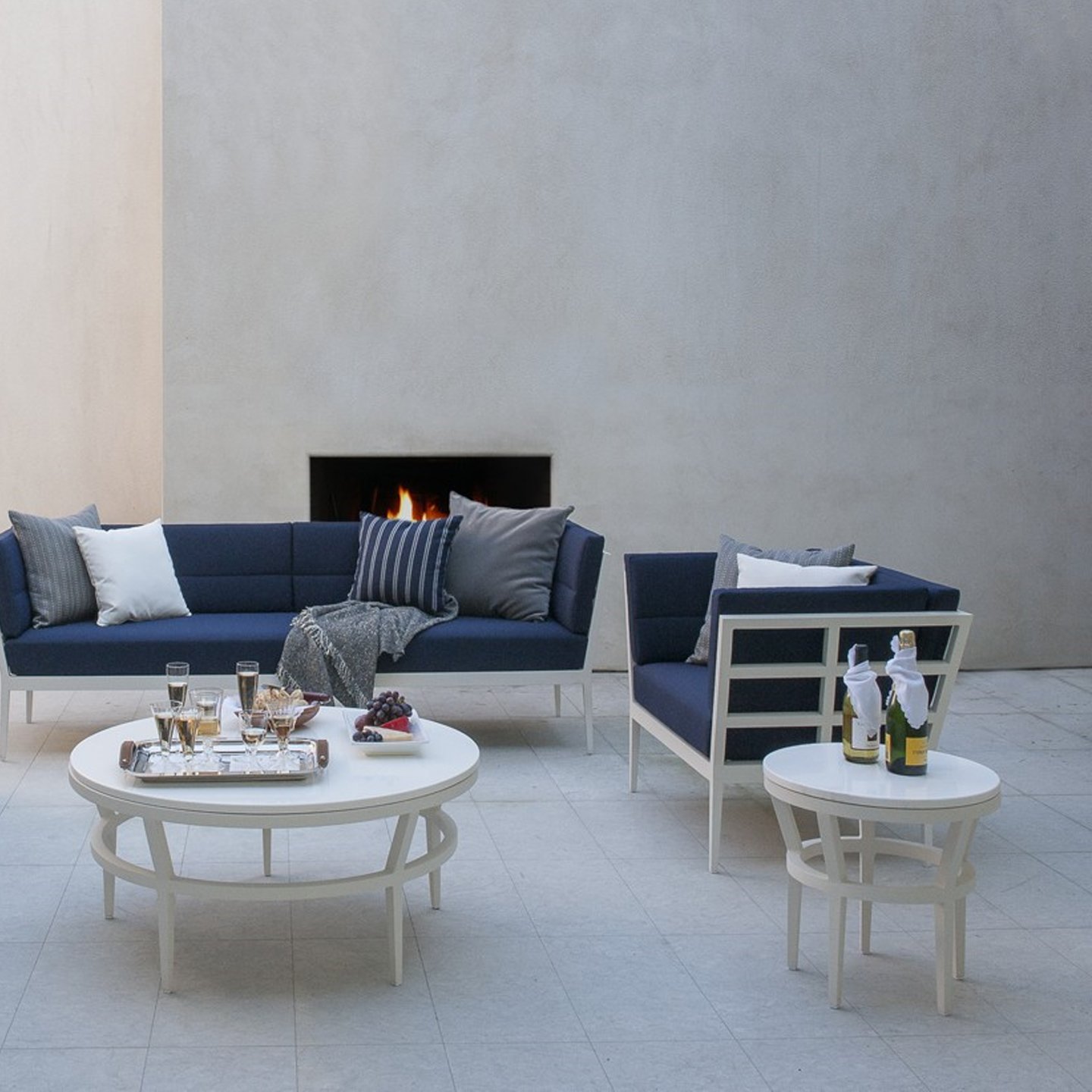 Haworth Slant Table with white top in a home living room used as a side table and center coffee table