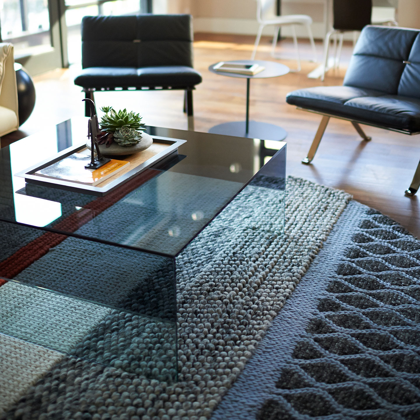 Haworth Smoke Table with square shape and smoked glass in office lounge area