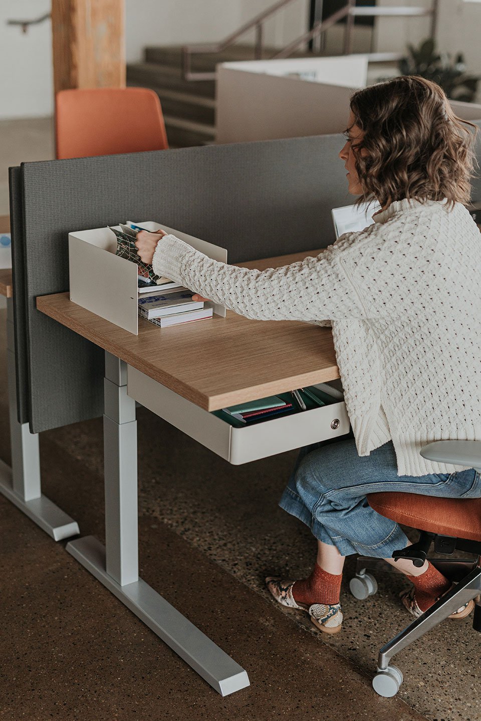 Haworth Upside Height Adjustable Table being used in as an office workspace