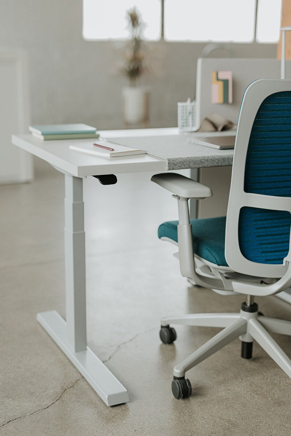 Haworth Upside Height Adjustable Table being used in as an office workspace