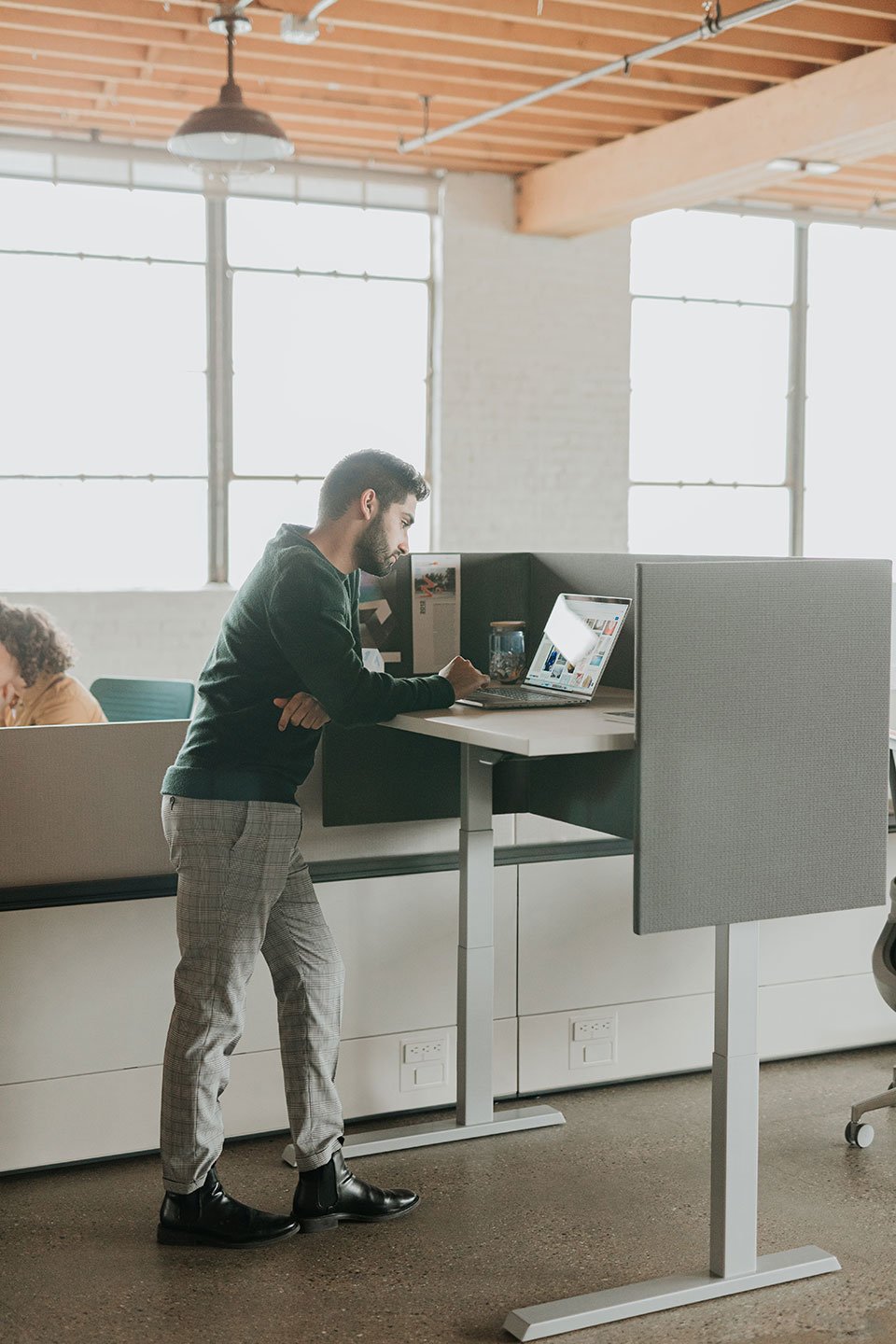 Haworth Upside Height Adjustable Table being used in as an office workspace