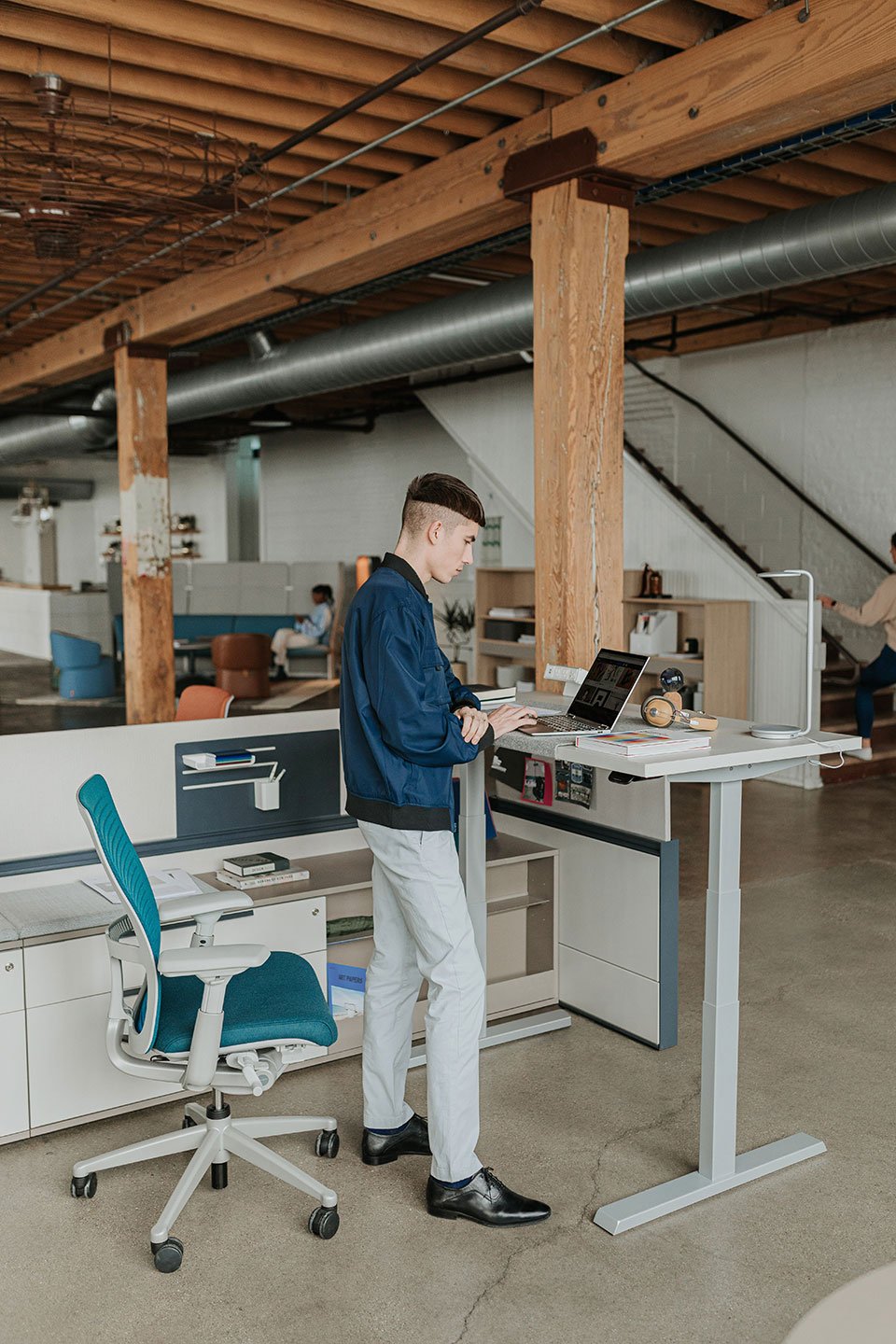 Haworth Upside Height Adjustable Table being used in as an office workspace in a casual office area