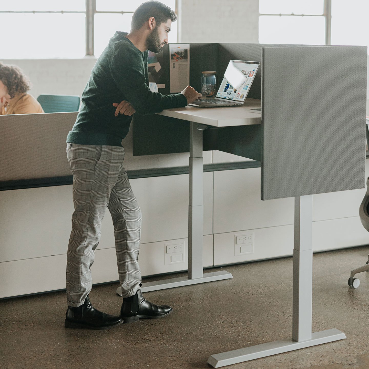 Haworth Upside Height Adjustable Table being used in an office as a workspace that is partially closed