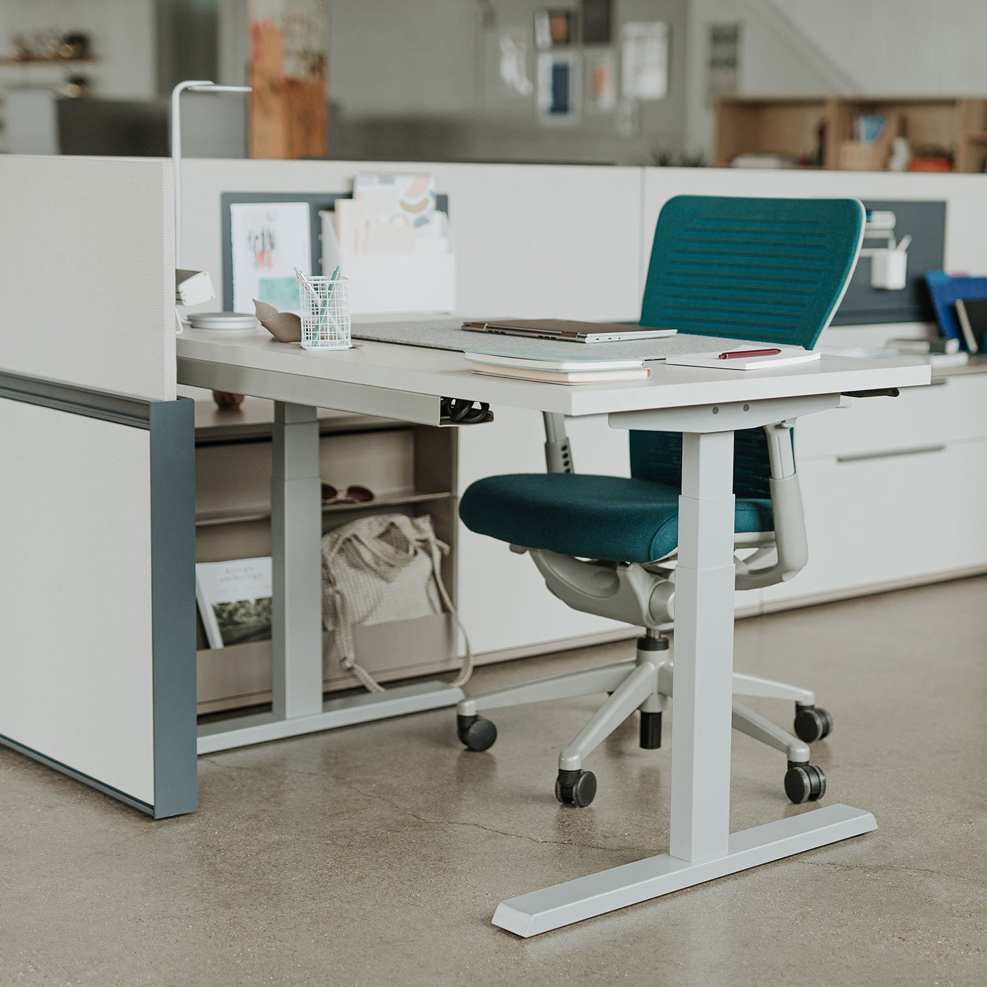 Haworth Upside Height Adjustable Table with chalk top in an office space being used as a desk