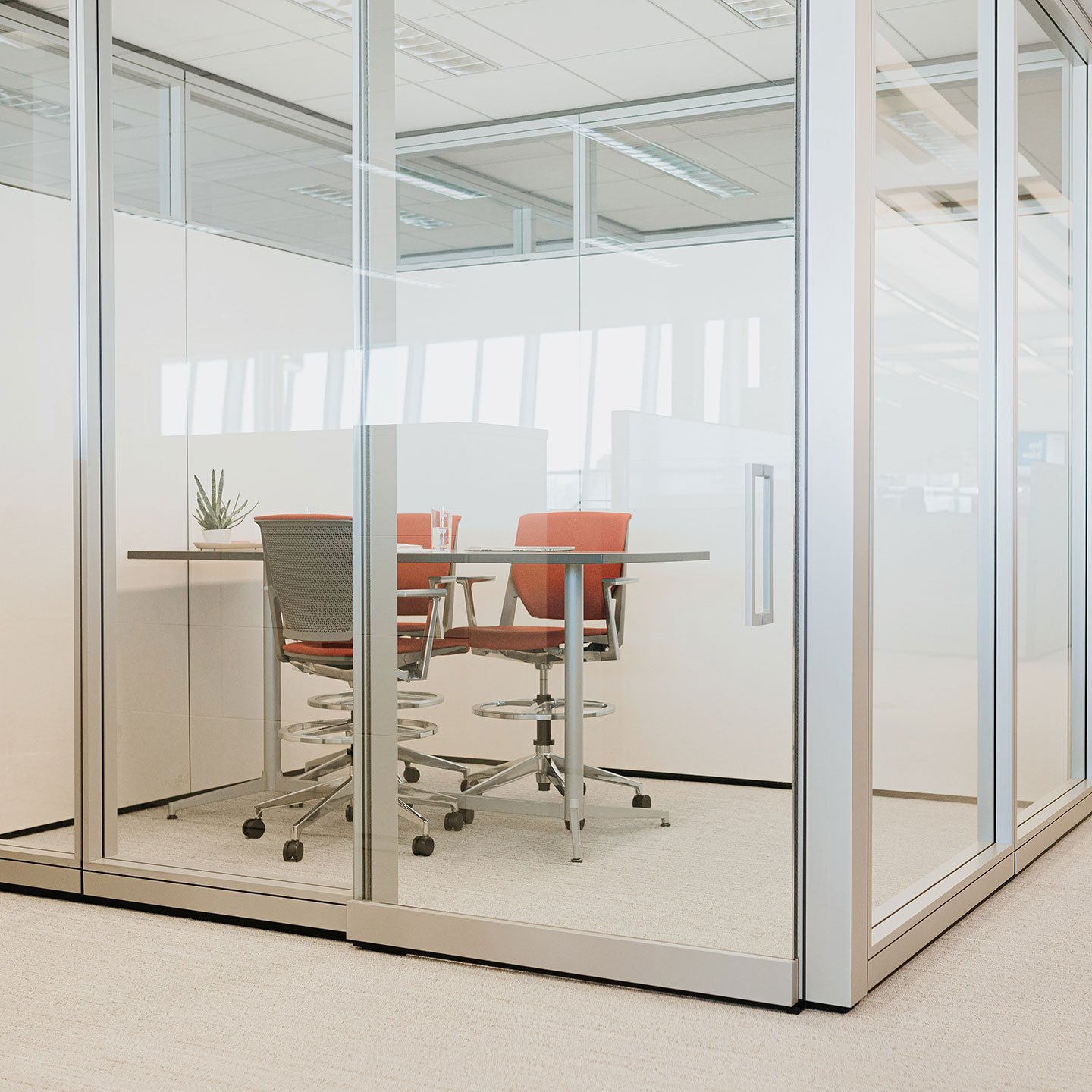 Haworth Enclose Wall in private work area in office with red chair and desk to work at