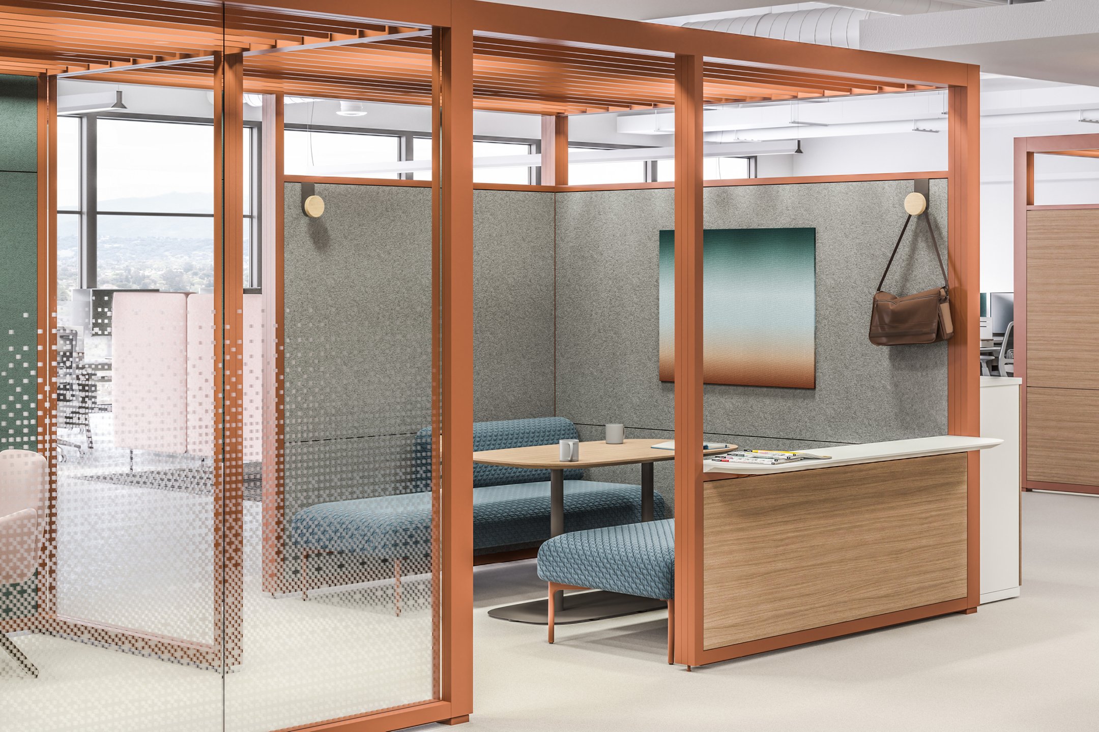 Haworth Pergola Workspace with bronze trim and veneer panels outside and inside a grey wall and blue chairs with a table between them for collaboration