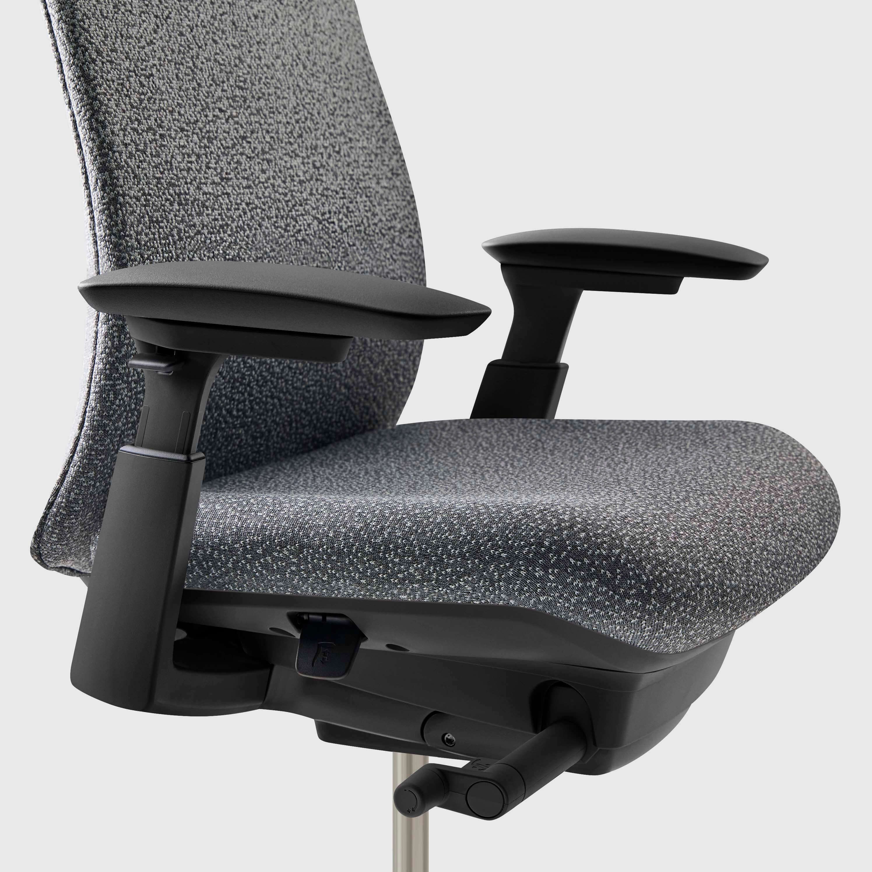 Close-up of the mesh back and seat of a gray office chair.