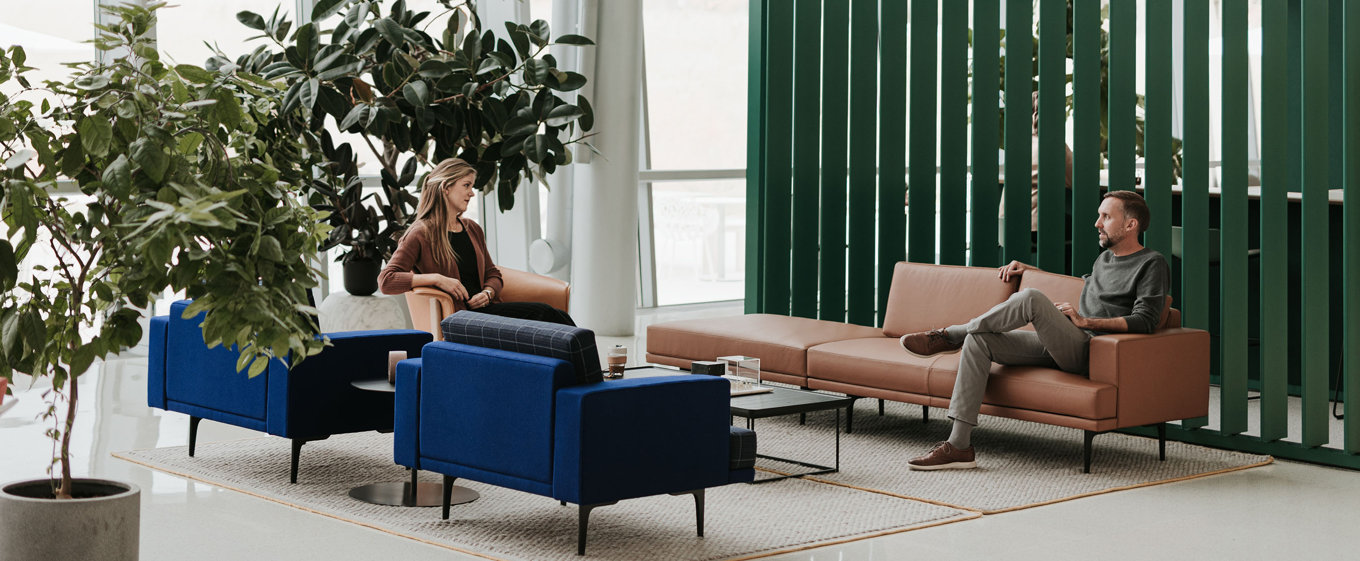 Haworth Resonate and Cabana lounge sofas and chair next to a Pergola workspace