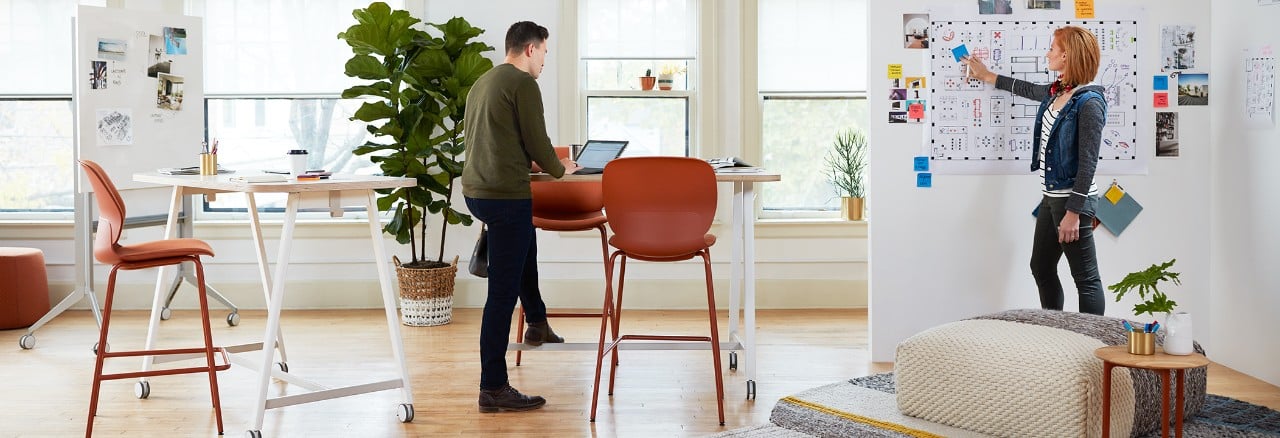 Coworkers collaborating at PopUp table mobile workspace